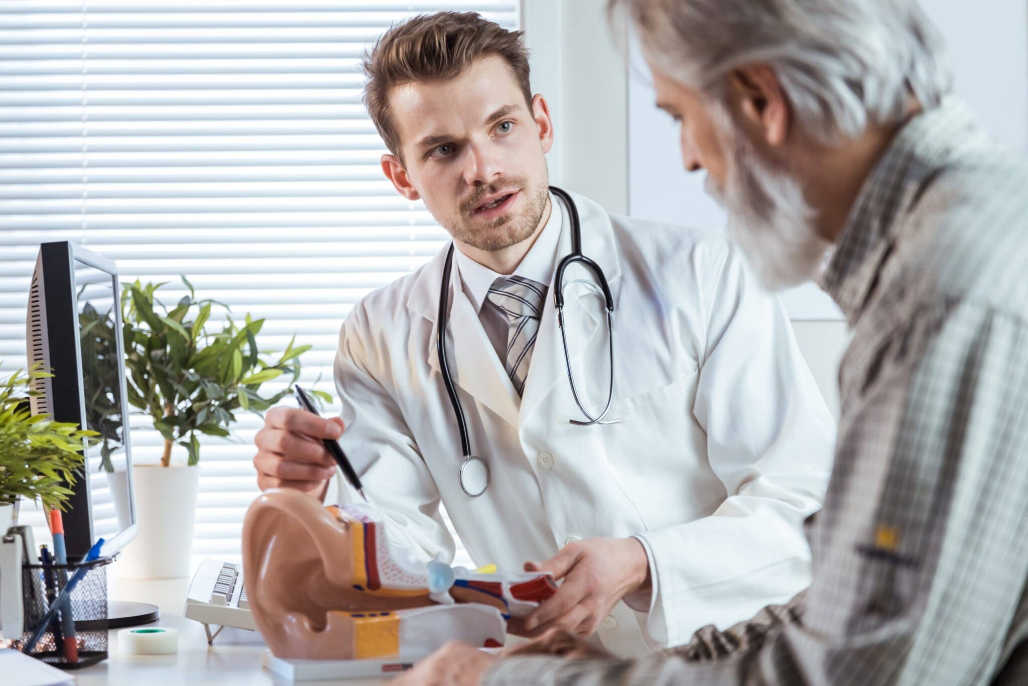 Audiologist talking to patient.