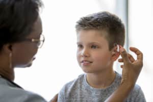 Young boy with hearing aids